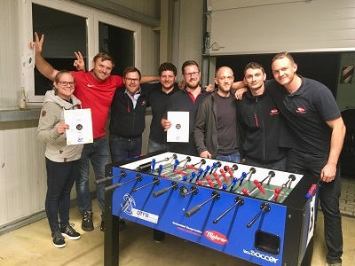 Employees group picture at the table football tournament of the Balingen company